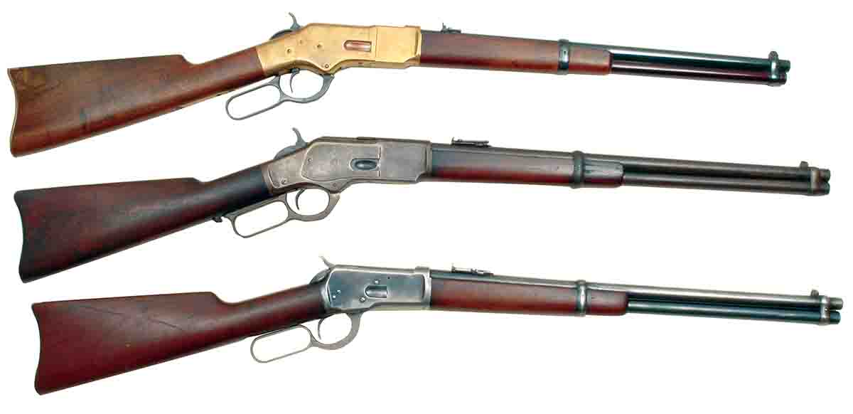 These Winchester .44 saddle ring carbines include (top to bottom) a Model 1866 Uberti replica, a Winchester Model 1873 (1899 vintage) and a Model 1892 (1912 vintage).